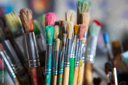 Artist paintbrushes in an art studio used to create works of art