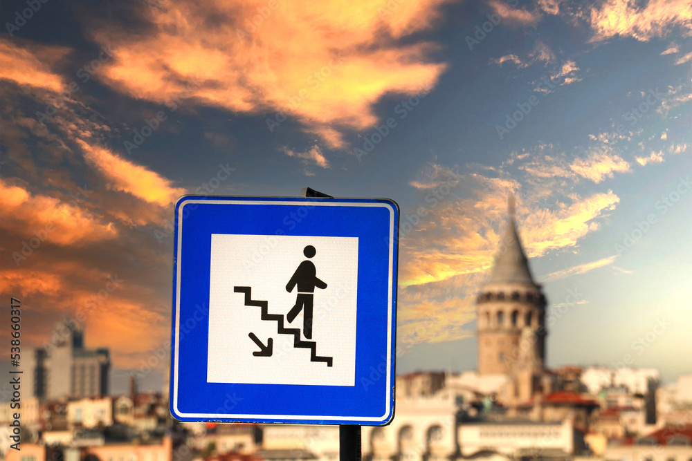 Obraz premium stair sign with galata tower in the background, traffic sign