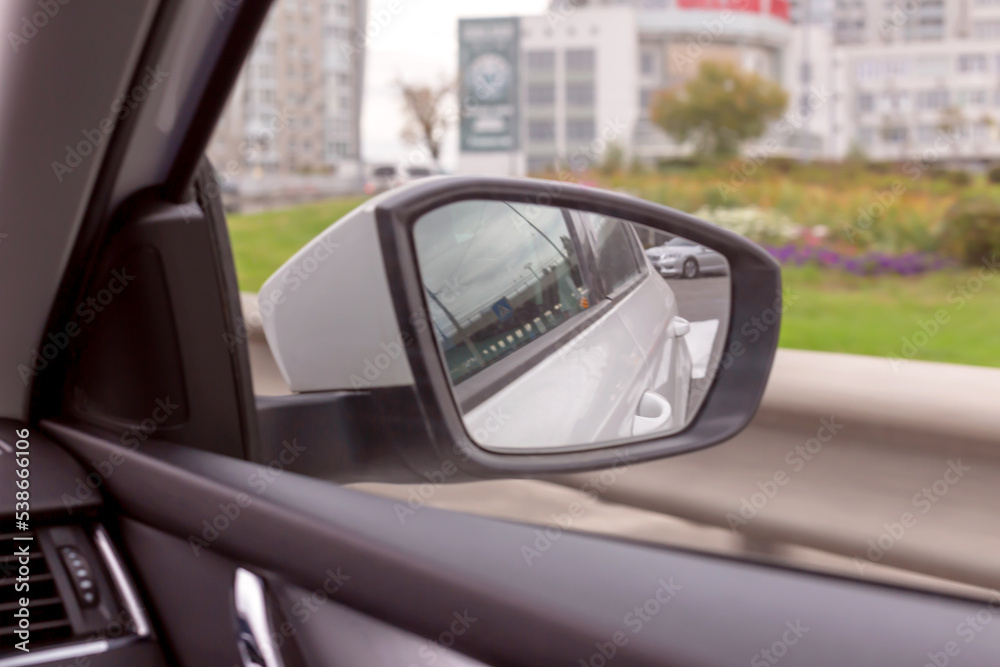 Side rear view mirror of the moving car. Toning Side rear view mirror of the moving car. Toning