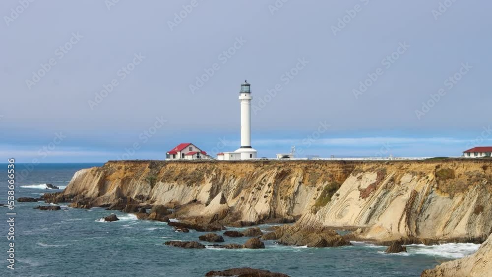 View of Point Arena Lighthouse on a rocky seashore in California by historic route 101 View of Point Arena Lighthouse on a rocky seashore in California by historic route 101