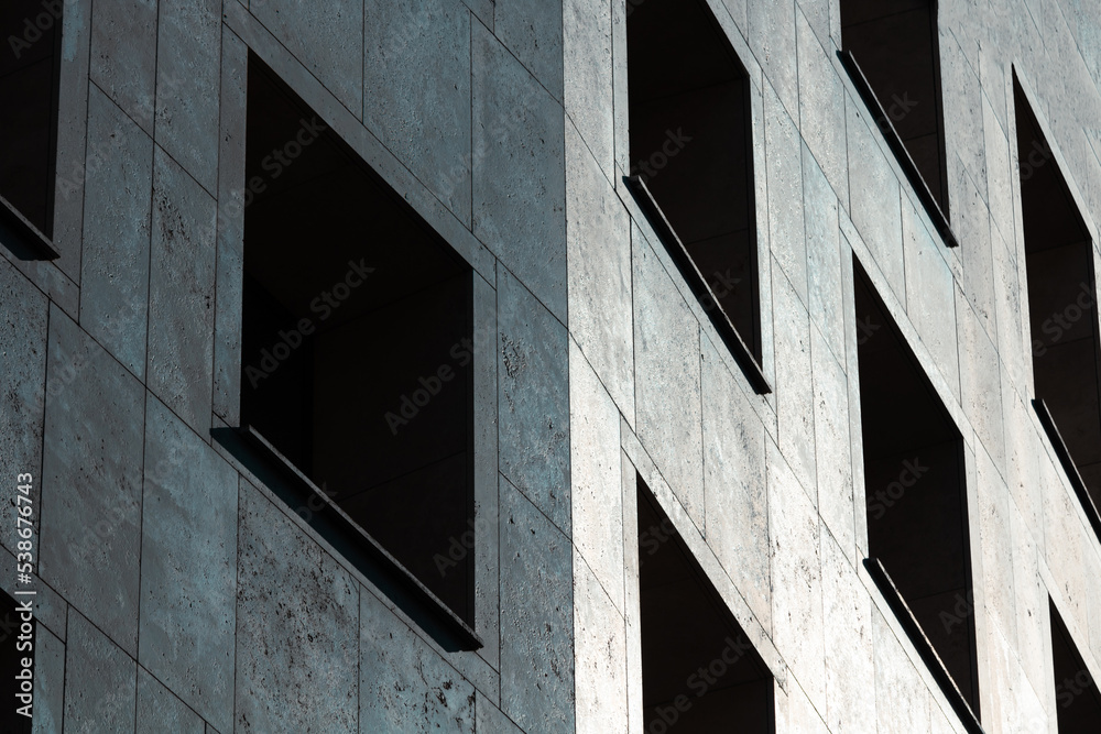 Facade of a modern building with dark windows Facade of a modern building with dark windows