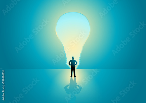 Man standing in front of bulb shape door