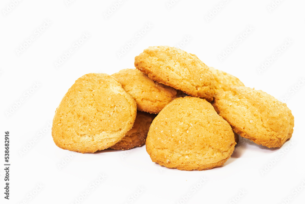 Several sugar cookies laid out in a slide on a white Several sugar cookies laid out in a slide on a white