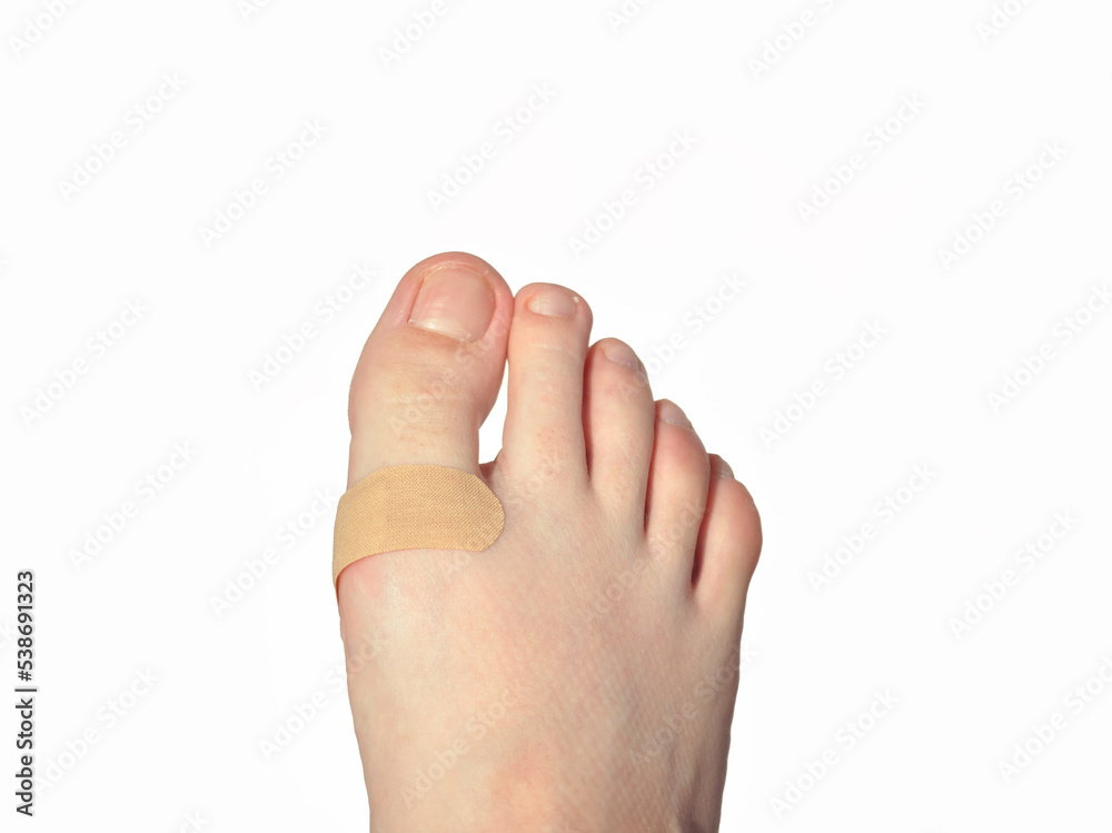 foot with fingers and a plaster foot with fingers and a plaster