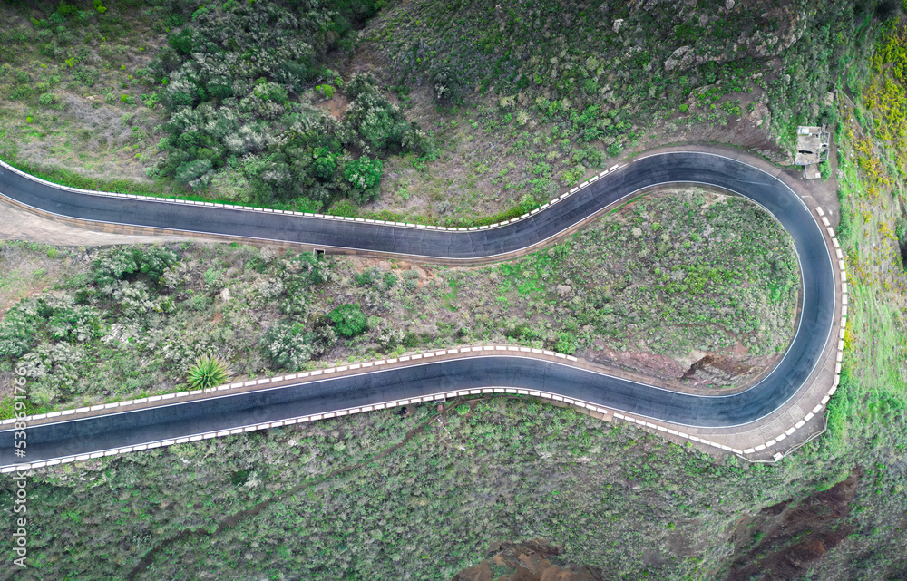 Aerial view of a winding road in the countryside without cars