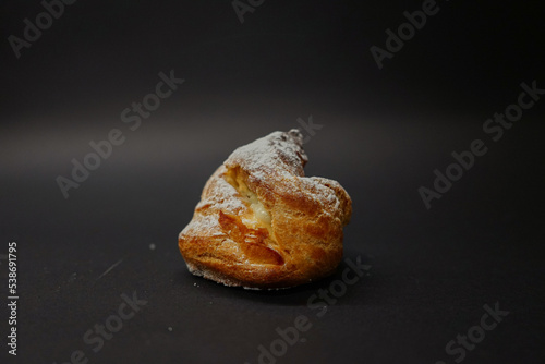 Eclair on a black background