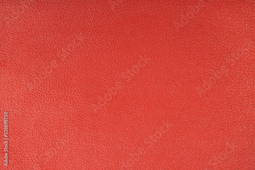 Texture background of velours red fabric. Fabric texture of upholstery furniture textile material, design interior, wall decor. Fabric texture close up, backdrop, wallpaper.