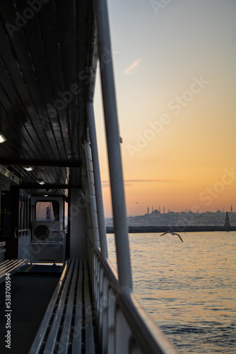 Sunset from the ferry  historical istanbul peninsula and sunset view from the ferry  vertical shot  Istanbul  Turkey. Selective Focus  Grain.