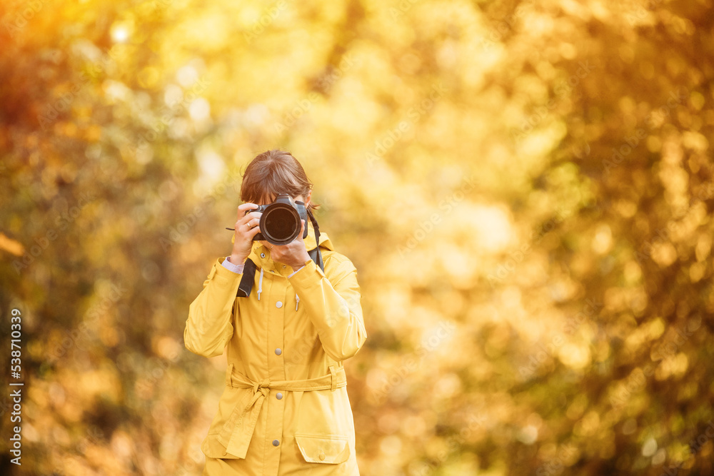 Young Pretty Caucasian Happy Smiling Girl Woman On Road In Autumn Forest. Tourist Woman Walking And Taking Photos In Forest. Fun Enjoy Outdoor Autumn Nature. Lady Photographed Nature.
