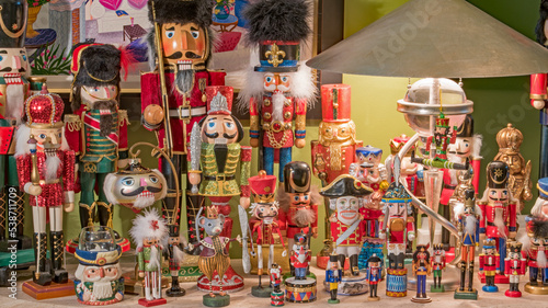 A nutcracker collection is displayed on a table for Christmas. 