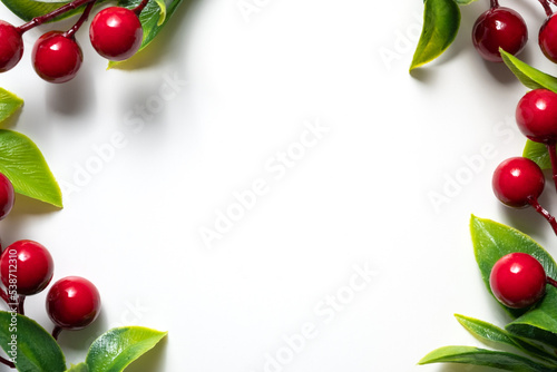 Christmas Holly With Red Berries. Traditional festive decoration. Holly branch with red berries on white.