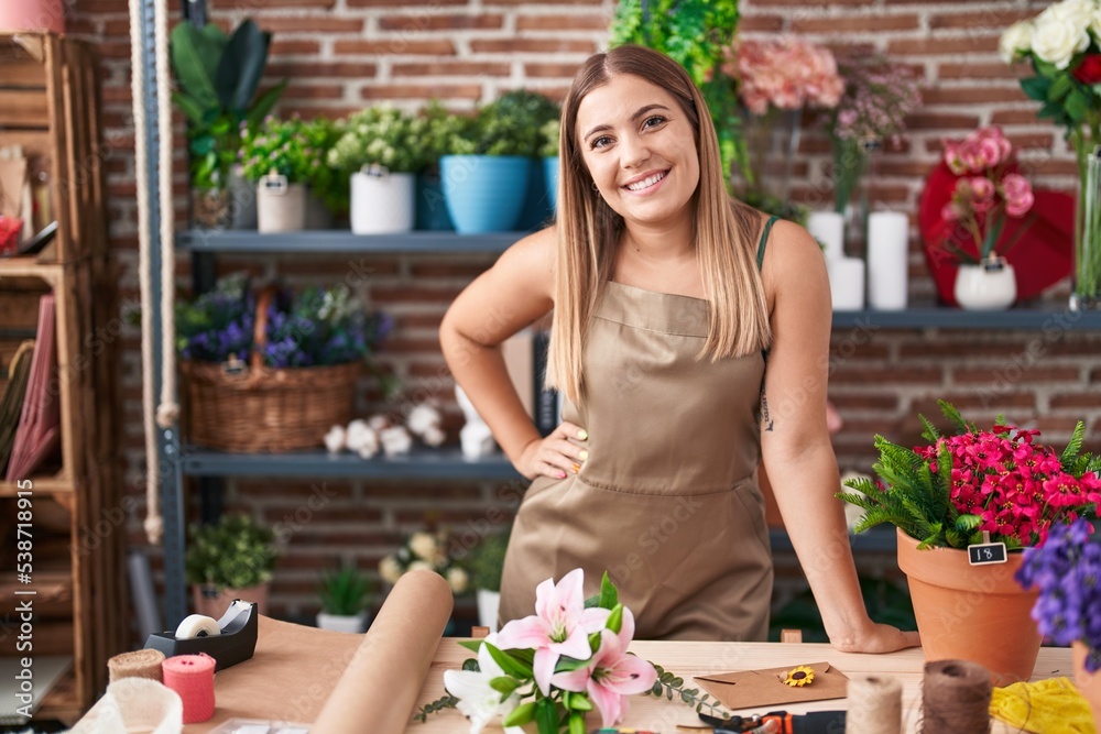 Young beautiful hispanic woman florist smiling confident standing at florist