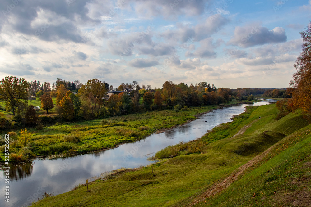 Autumn landscape Memele river with colorful trees