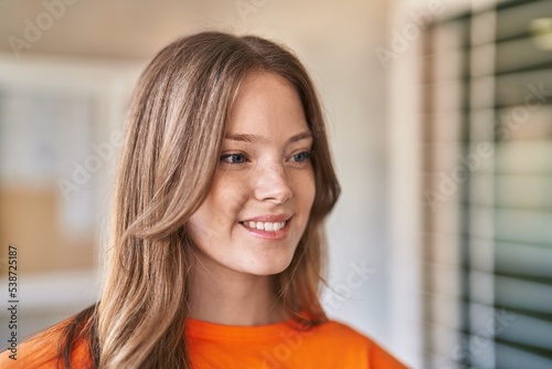 Free Download Young woman smiling confident looking to the side at university - GFXLoad