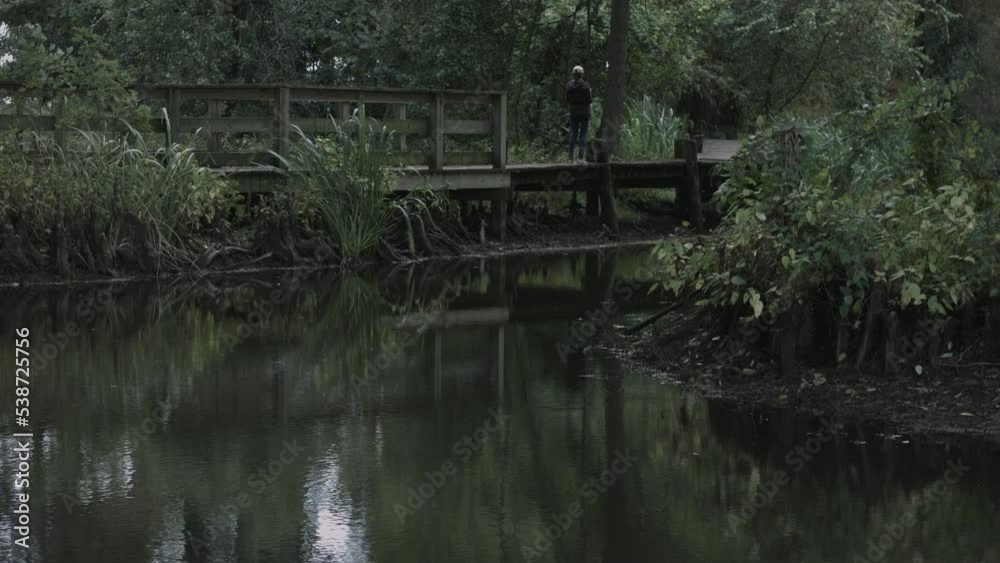 Young Woman Enjoys Nature Photography at Reelfoot Lake State Park 4K Young Woman Enjoys Nature Photography at Reelfoot Lake State Park 4K