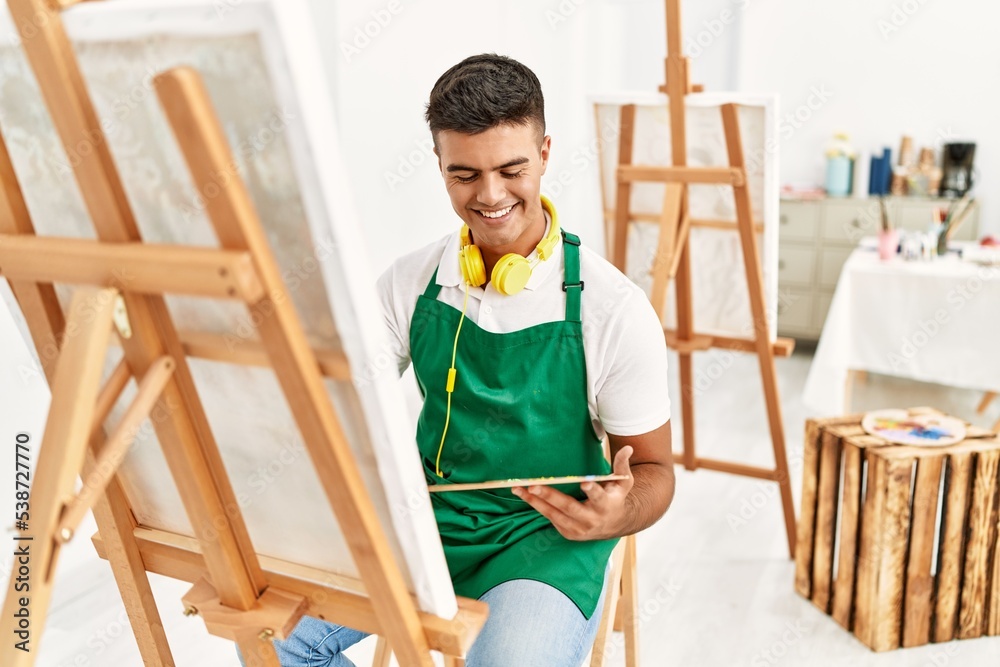 Young hispanic man smiling confident drawing at art studio Young hispanic man smiling confident drawing at art studio