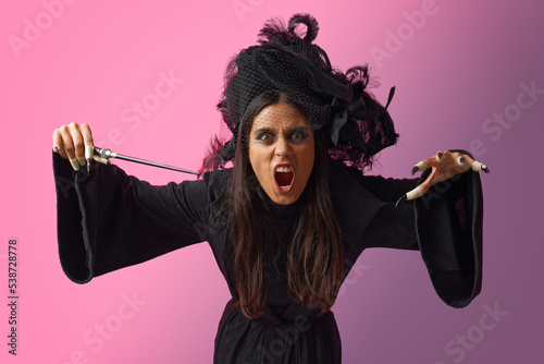 Εκτύπωση καμβά Scary angry witch attacking you, casting spell with her wand, feeling angry and