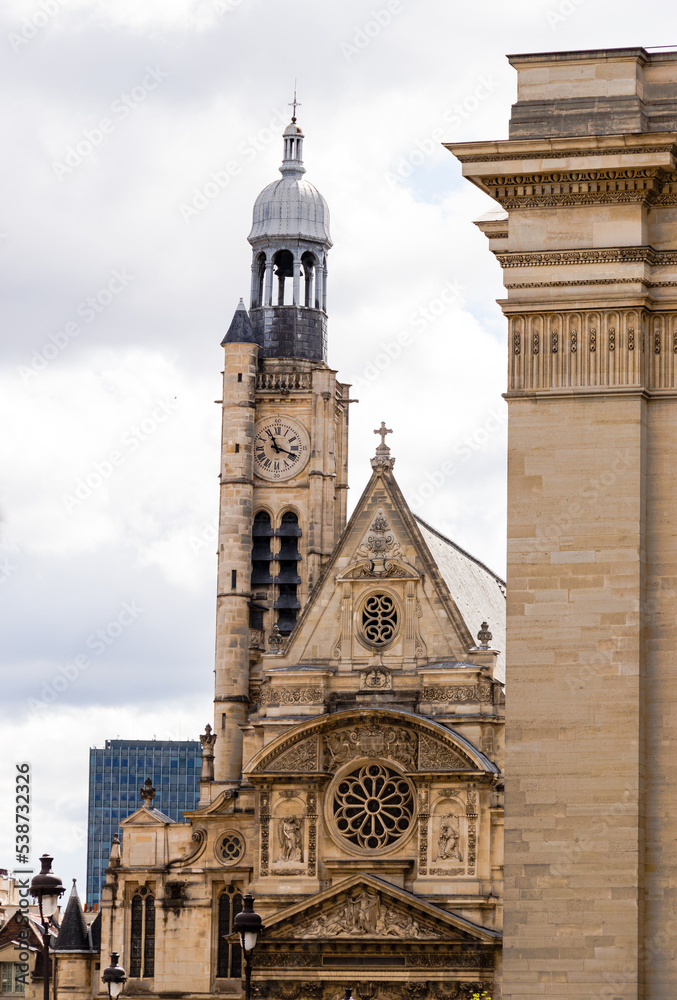 View of a church and its bell tower in the city of paris
