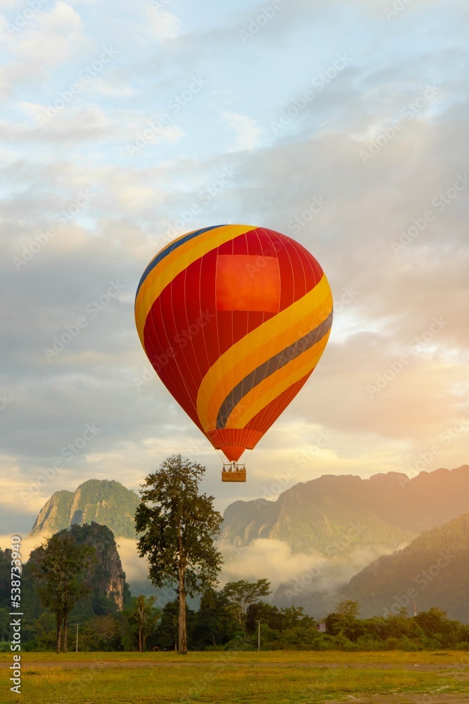Hot air ballloon with view mountain and sunlight