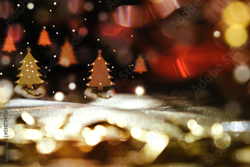 Christmas toys, decor and bokeh on black night background, bright glow bokeh. Glitter light. Copy space. Happy New Year