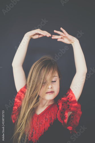 Young girl dancing passion music. photo