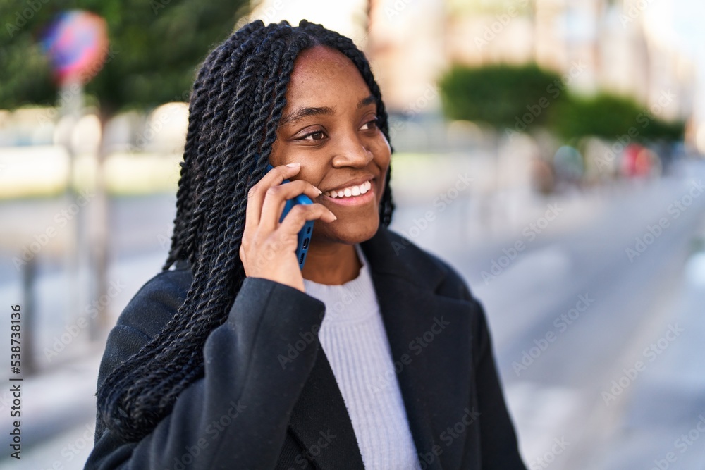 African american woman smiling confident talking on the smartphone at street African american woman smiling confident talking on the smartphone at street