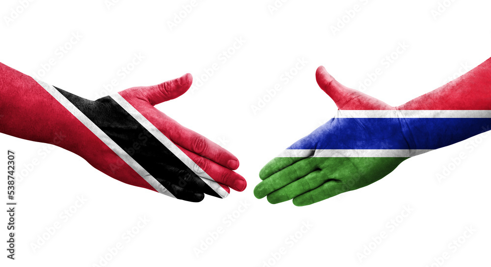 Handshake between Gambia and Trinidad Tobago flags painted on hands, isolated transparent image.