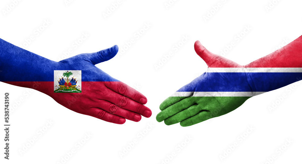 Handshake between Gambia and Haiti flags painted on hands, isolated transparent image. Handshake between Gambia and Haiti flags painted on hands, isolated transparent image.