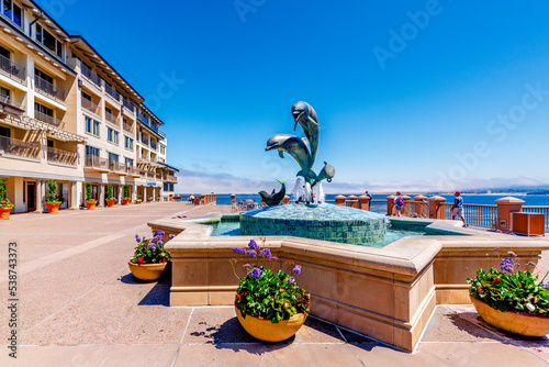 Monterey Bay, California with fountain and city photo