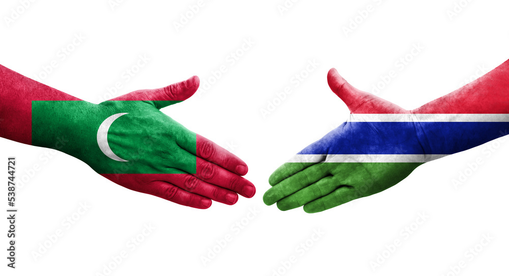 Handshake between Gambia and Maldives flags painted on hands, isolated transparent image.