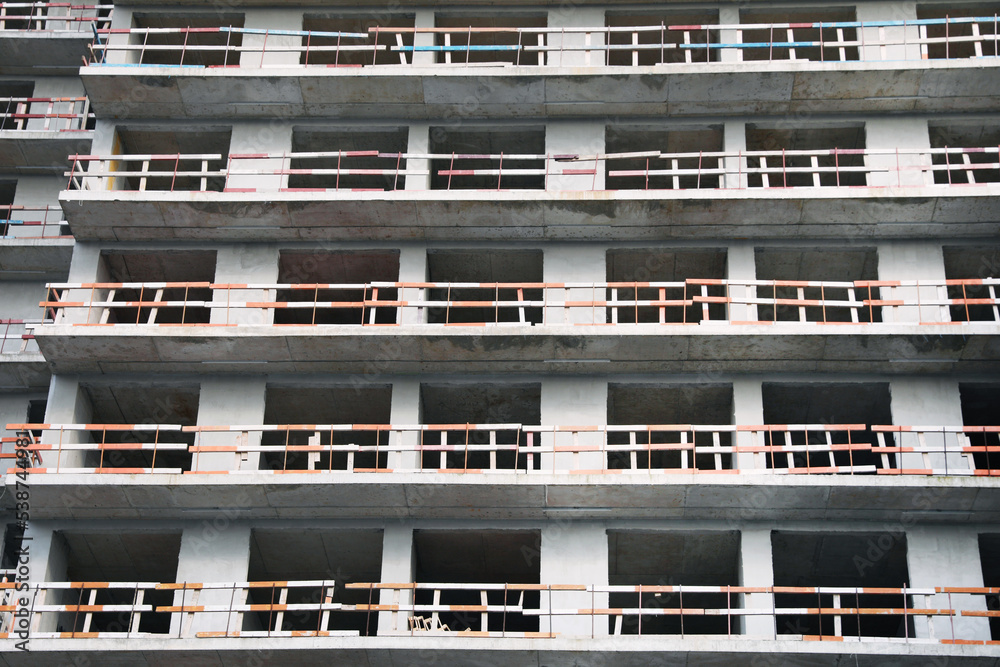 Construction site with unfinished residential building outdoors