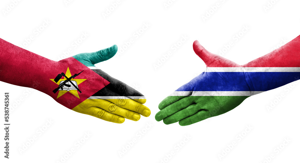 Handshake between Gambia and Mozambique flags painted on hands, isolated transparent image.