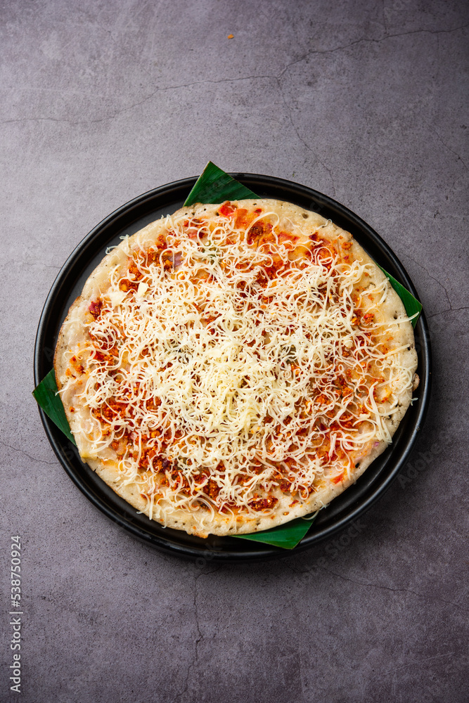 Cheese uttapam pizza, south Indian food with a twist. served with sambar and chutney Cheese uttapam pizza, south Indian food with a twist. served with sambar and chutney