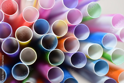 Multi-colored straws for cocktails close-up.