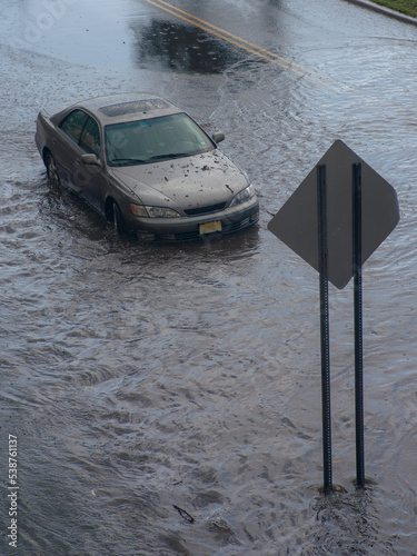 Flooded vehicle stuck in flash flooding photo