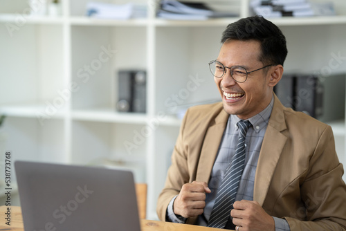 Wallpaper Mural Excited happy Asian businessman looking at the computer laptop screen, celebrating an online win, overjoyed young asian male screaming with joy. Torontodigital.ca