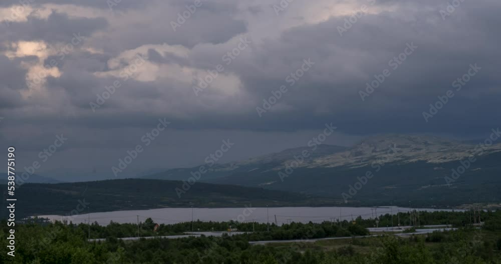 Time lapse of dark grey storm clouds blowing over Dovre Mountains Norway Time lapse of dark grey storm clouds blowing over Dovre Mountains Norway
