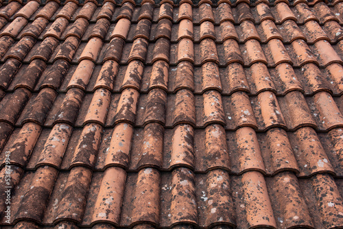 Old red terracotta roof tiles. Texture. Background pattern. Abstract. © Stefan