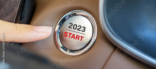 Fotografie, Tablou Finger press a car ignition button with 2023 START text inside  automobile