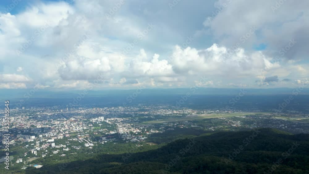 Forward, flying from Doi Suthep in Thailand toward panorama of city Forward, flying from Doi Suthep in Thailand toward panorama of city