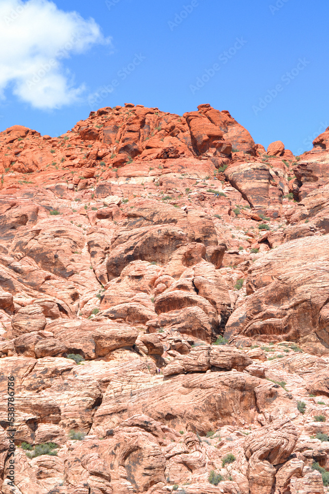 Red coloured rock formations under a blue sky, Red Rock Canyon, Las Vegas Red coloured rock formations under a blue sky, Red Rock Canyon, Las Vegas