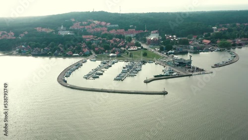 drone footage of Nida town in Lithuania, harbor and town can be seen in this clip, shot at sunny summer day photo
