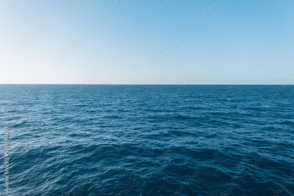 Beautiful views of blue clear water with waves and a clear horizon. Travel and summer vacation. Sea, water and sky Beautiful views of blue clear water with waves and a clear horizon. Travel and summer vacation. Sea, water and sky