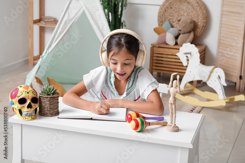 Little Mexican girl with he...