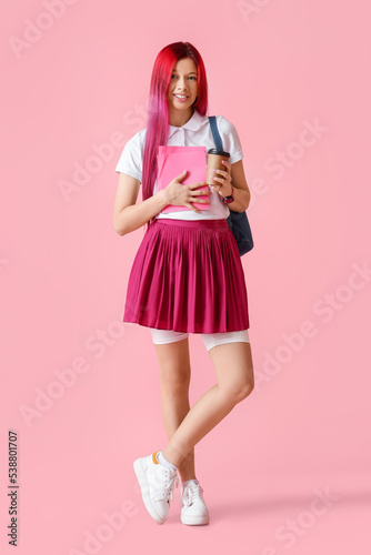 Young female student with b...