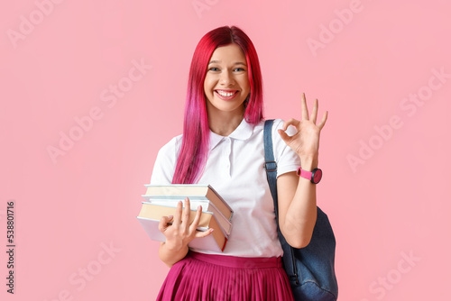 Young female student with b...