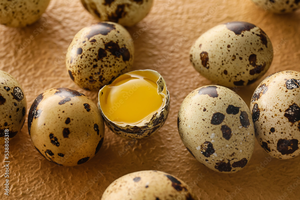Fresh raw quail eggs on color background, closeup