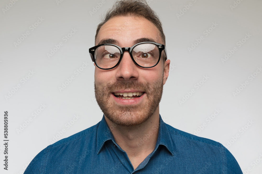 Fototapeta premium handsome casual man is crossing his eyes, smiling