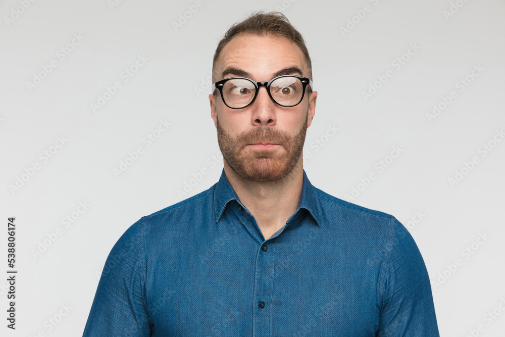 handsome casual man is crossing his eyes handsome casual man is crossing his eyes