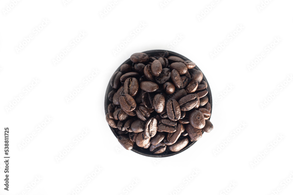 Coffee Beans on white background. close up. Coffee grounds. Freshly roasted coffee beans. Image of a drink made from granules, derived from coffee plant. Copy space for text. Coffee Beans on white background. close up. Coffee grounds. Freshly roasted coffee beans. Image of a drink made from granules, derived from coffee plant. Copy space for text.